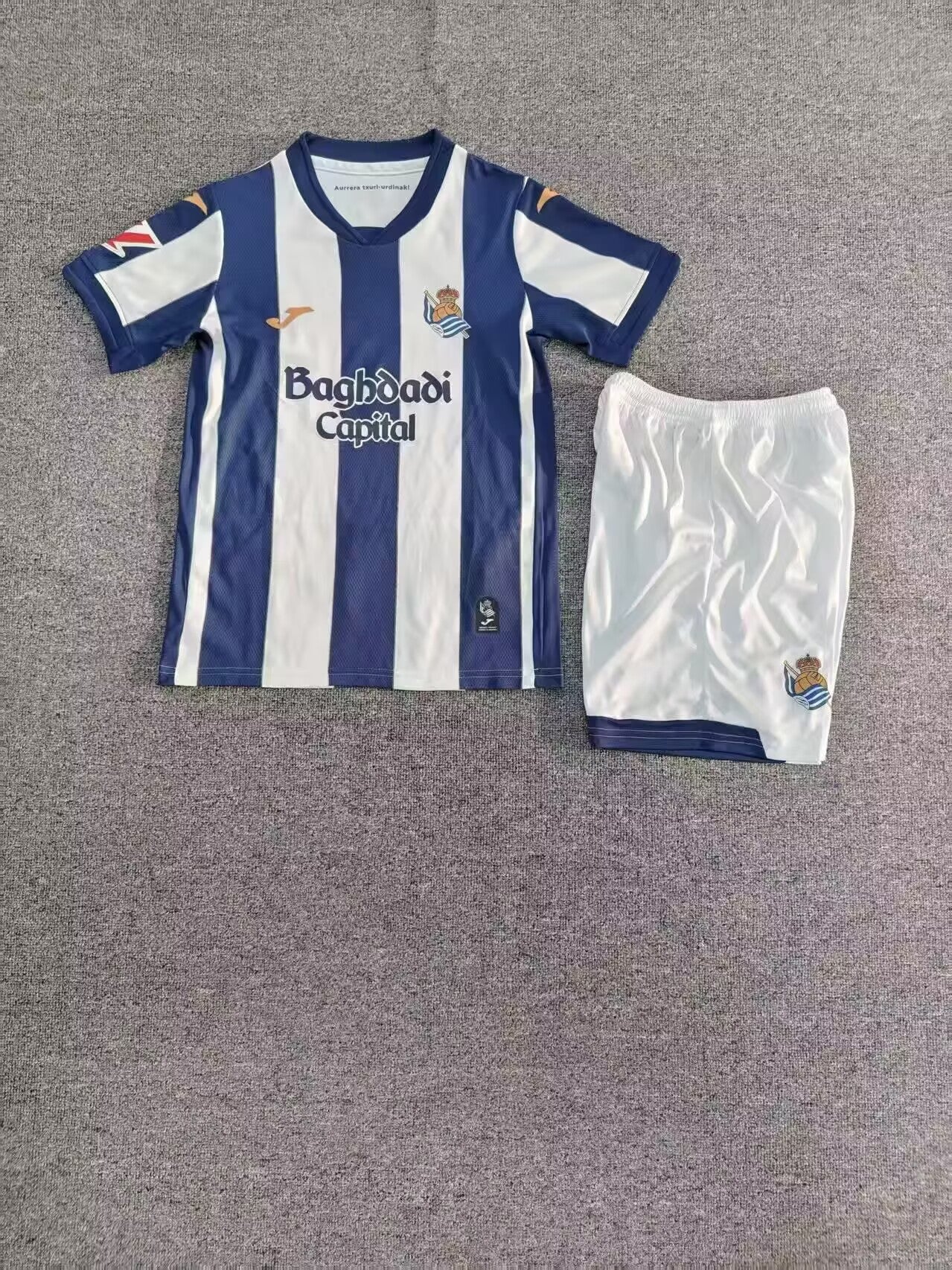 KIT NIÑO REAL SOCIEDAD 2026-27 1A EQUIPACION